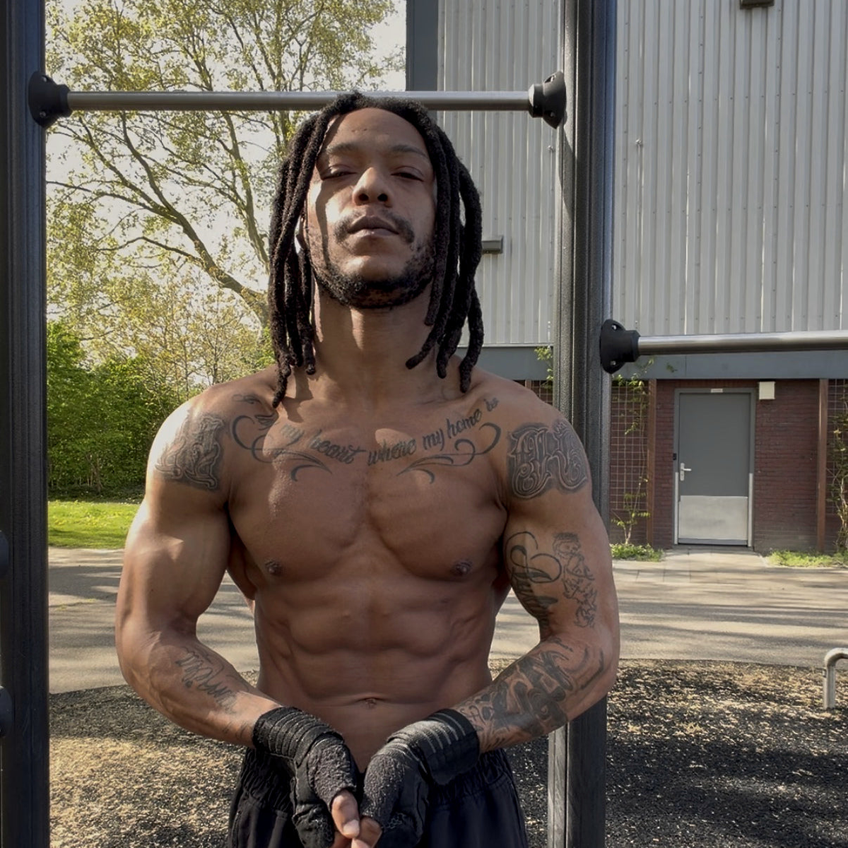 MotionBar calisthenics athlete training outdoors at sunset